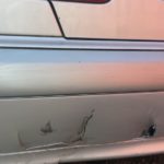 Cracked and scratched plastic bumper