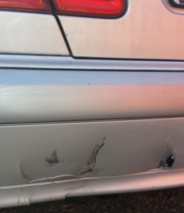 Cracked and scratched plastic bumper